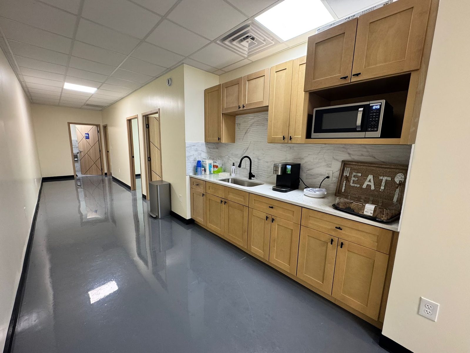 Shared kitchenette with coffee bar and microwave