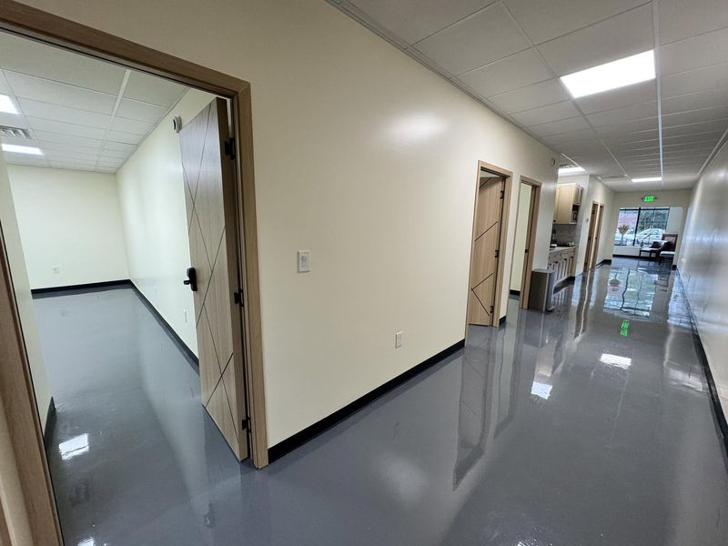 Corridor of private suites with doors open