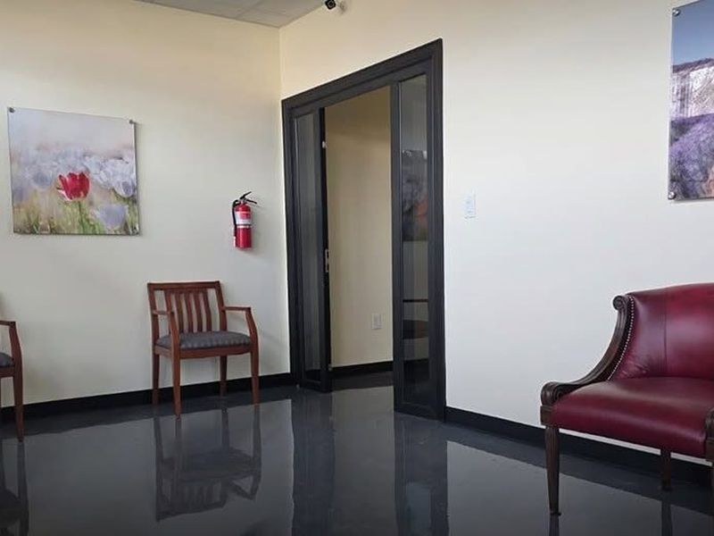 Lobby with leather chairs and framed art